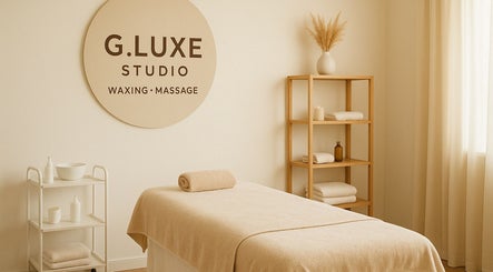 Tranquil treatment room at G.luxeStudio, Christ Church, BB, featuring massage bed and minimal decor.