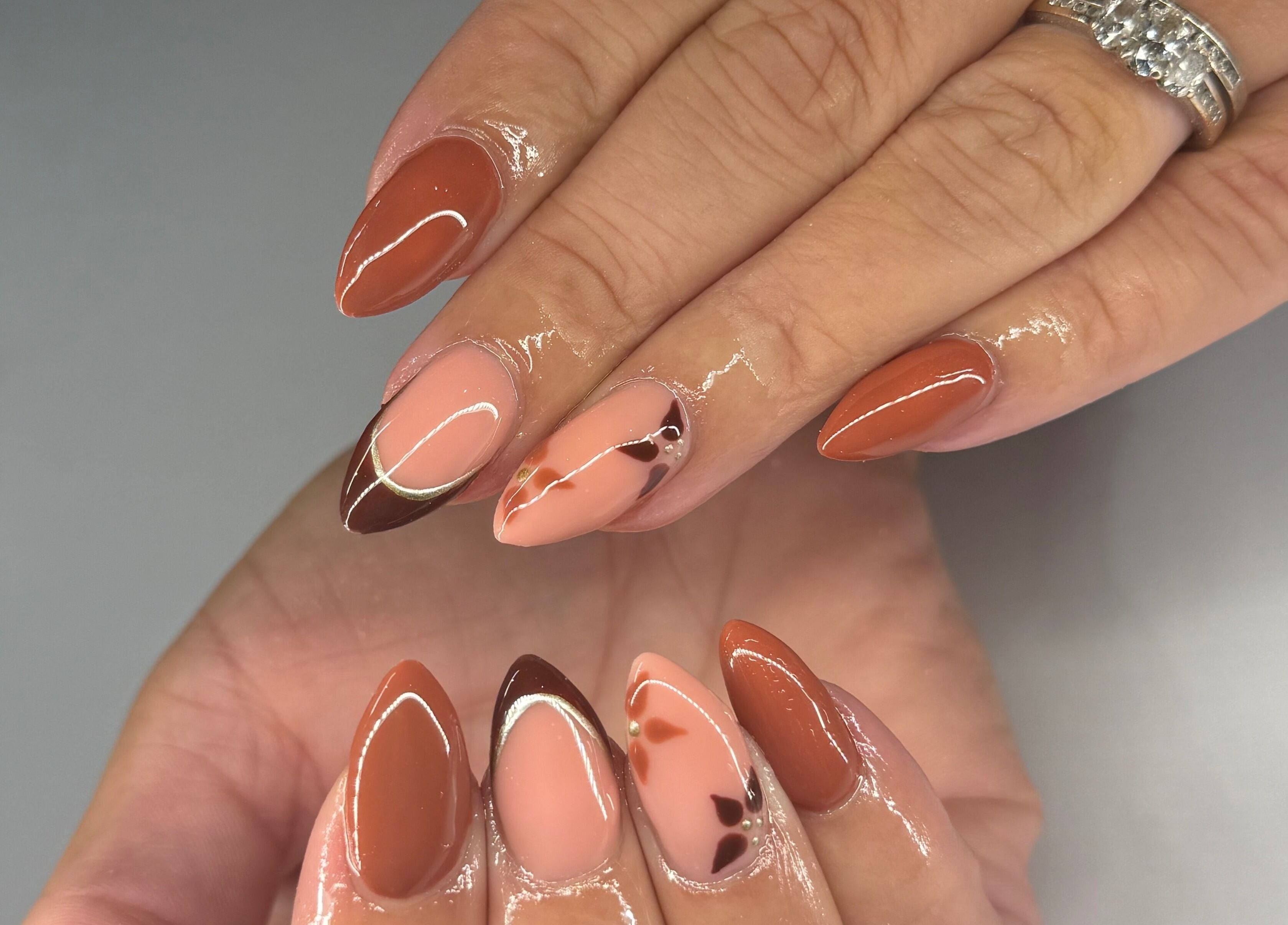 Elegant autumn-themed nail art at Nikki Nails, Llansamlet, Wales, GB.