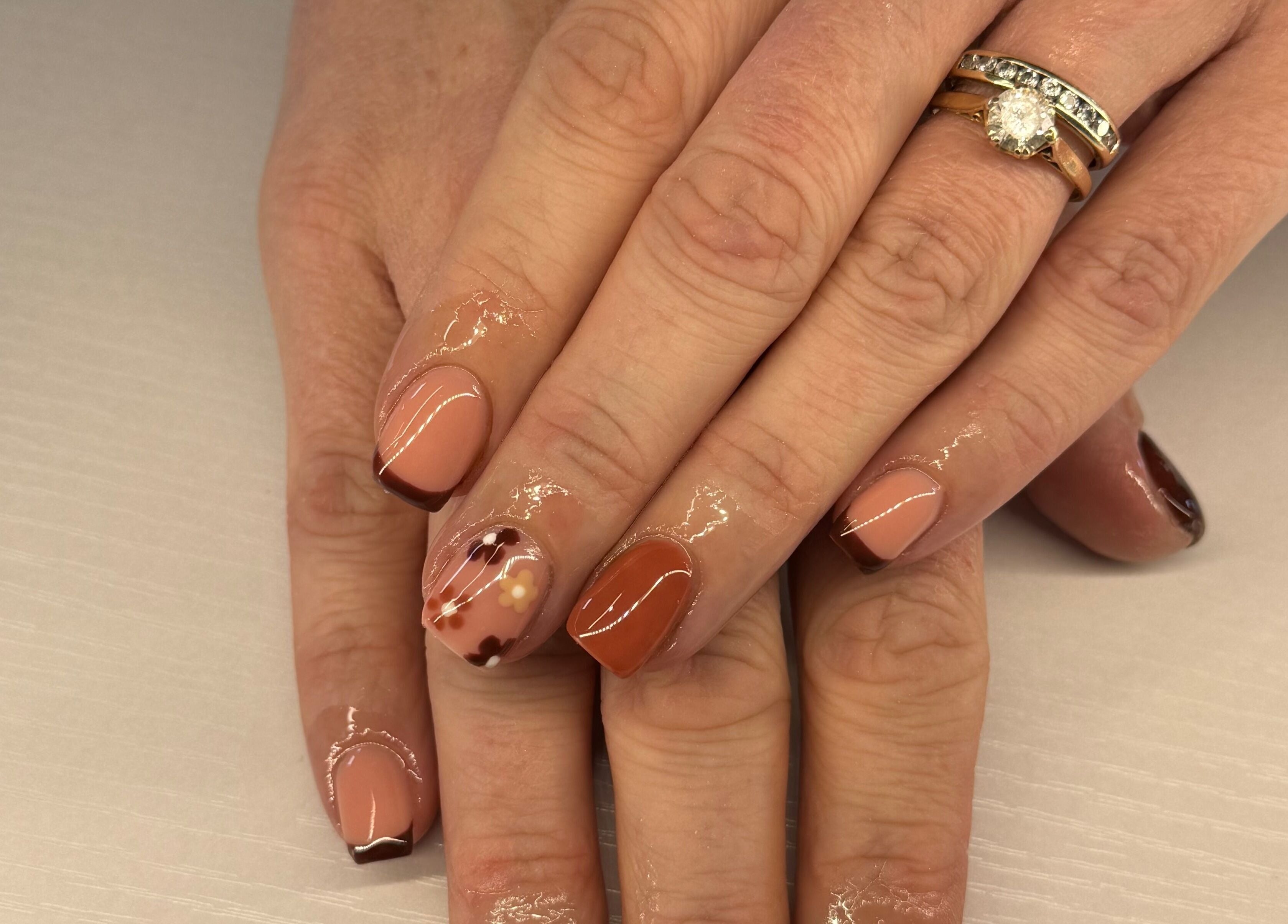 Stylish manicure with brown tones at Nikki Nails in Llansamlet, Wales, GB.