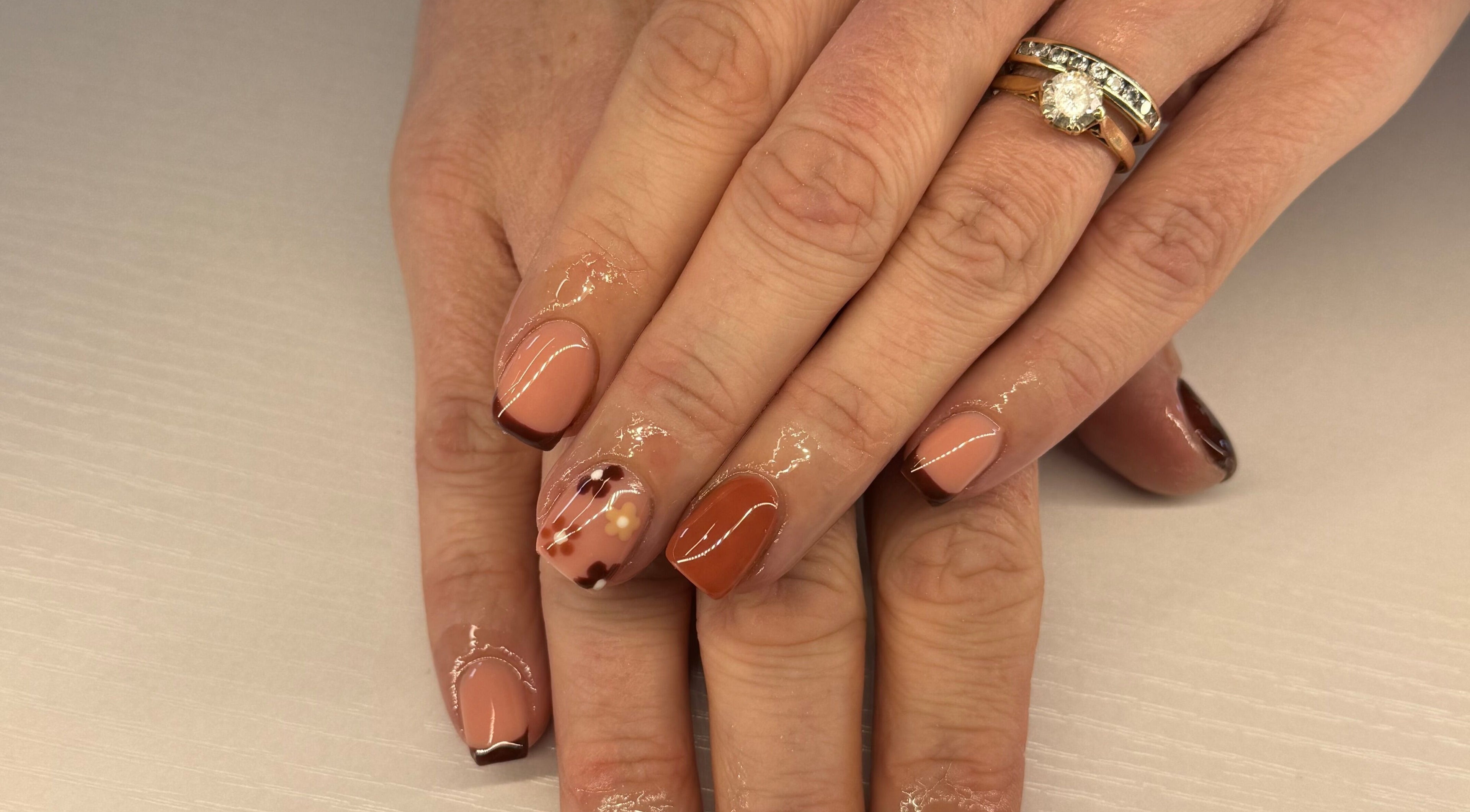 Stylish manicure with brown tones at Nikki Nails in Llansamlet, Wales, GB.
