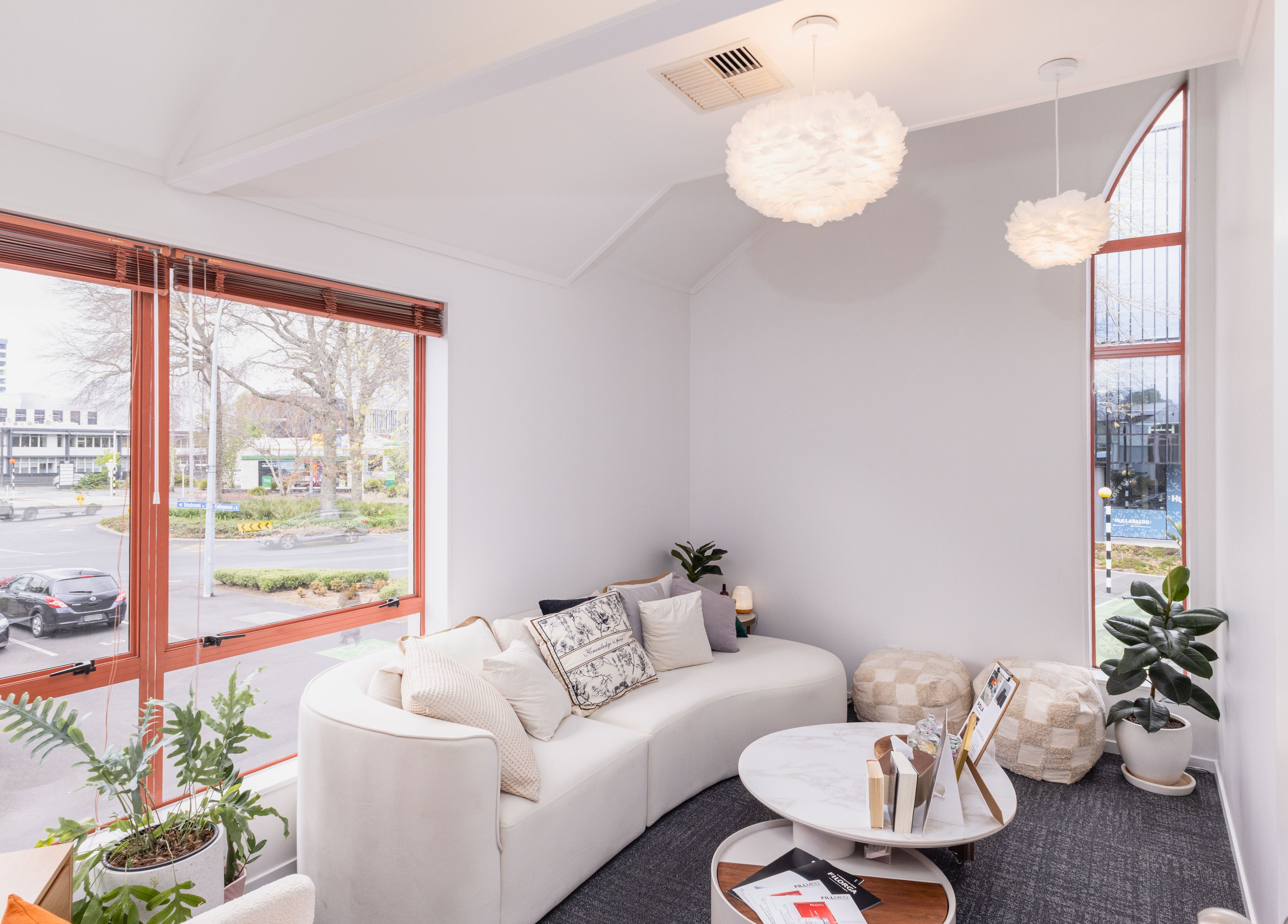 Bright lounge area at Tatoa Beyond (Hamilton), Hamilton, Waikato Region, NZ with cozy seating and large windows.