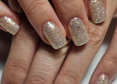 Sparkling nail art at Iconic Nails Lounge, Vernon, British Columbia, CA, showcasing elegant glitter finish.