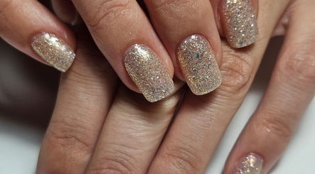 Sparkling nail art at Iconic Nails Lounge, Vernon, British Columbia, CA, showcasing elegant glitter finish.