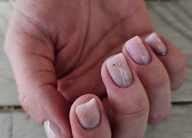Elegant manicure at Iconic Nails Lounge, Vernon, British Columbia, CA showcases a soft gradient nail design.