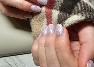 Sparkling manicure at Iconic Nails Lounge in Vernon, British Columbia, CA showcases elegant glittered nails.