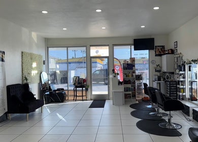 Interior of Belleza Glam Studio in South Gate, California, US featuring modern salon chairs and decor.