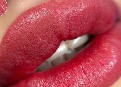 Vibrant red lips detailed at Afraclinic, Vancouver, British Columbia, CA, showcasing expert beauty techniques.