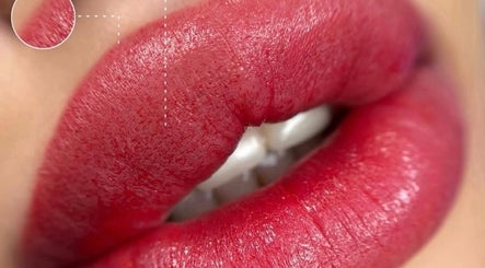 Vibrant red lips detailed at Afraclinic, Vancouver, British Columbia, CA, showcasing expert beauty techniques.