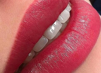 Close-up of vivid red lips at Afraclinic, Vancouver, British Columbia, CA showcasing beauty services.