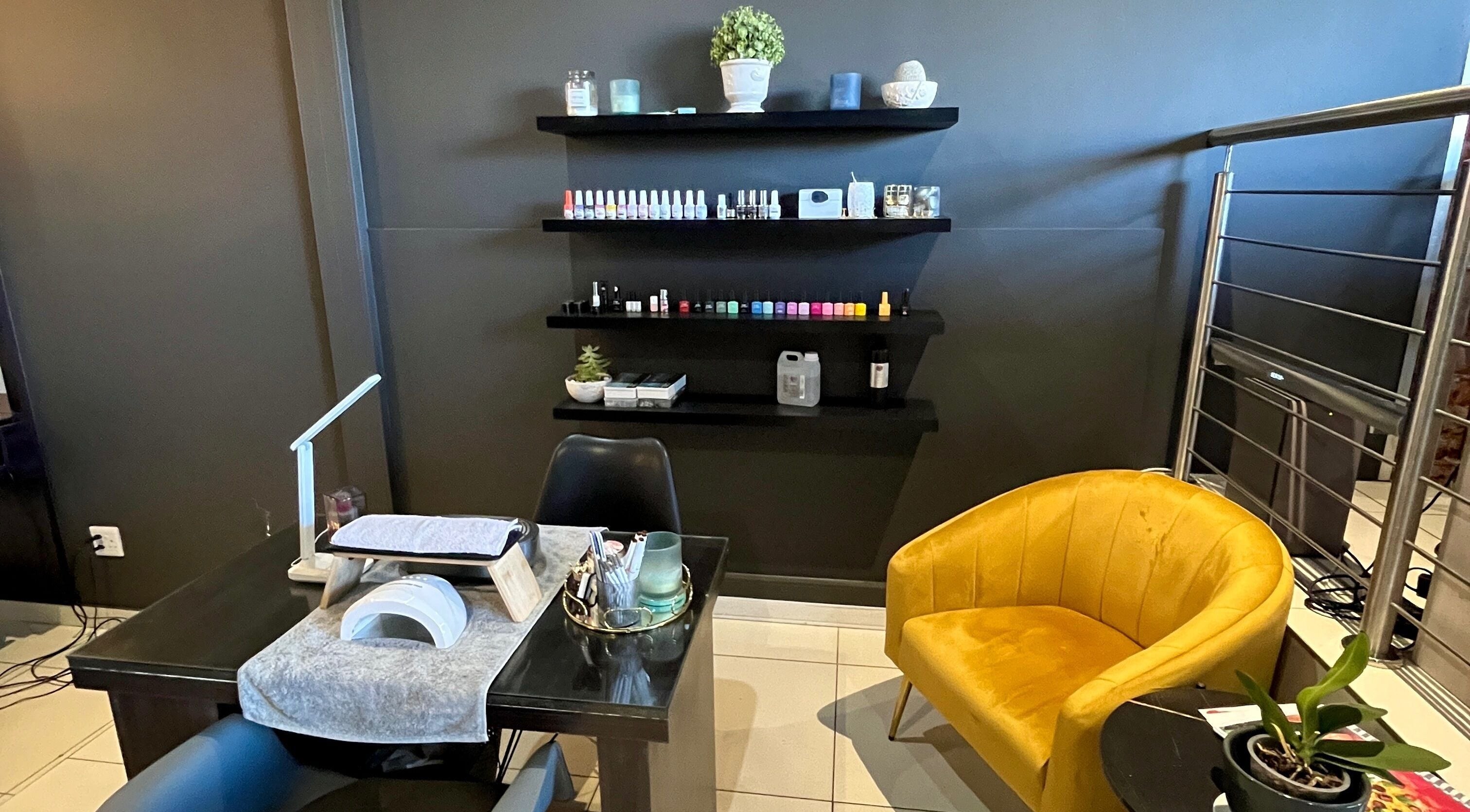 Pop On Perfection Nails in Upington showcases a modern nail station with cozy seating and polish selection.