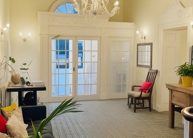 Elegant lobby of Louisa Sales Malia Organics in Christchurch, Hampshire Dorset with seating and vibrant decor.