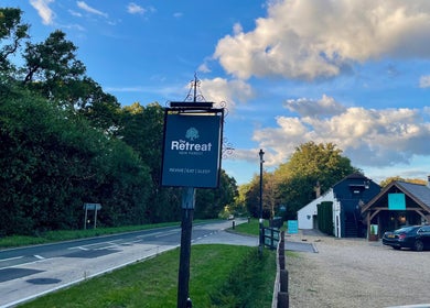 Charming venue sign in lush surroundings at Louisa Sales Malia Organics, Christchurch, Hampshire Dorset, GB.