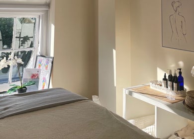 Tranquil treatment room at Louisa Sales Malia Organics, Christchurch, Hampshire Dorset, GB, with natural light.