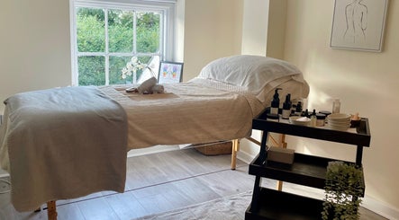 Massage bed at Louisa Sales Malia Organics, Christchurch, Hampshire, GB, enhancing relaxation and wellness.