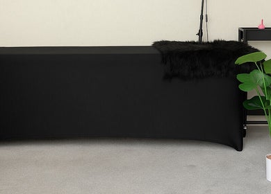 Elegant treatment room at LuxeLine Aesthetics, Woodford Green, England, GB, featuring a black massage table.
