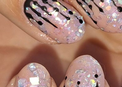 Sparkling nail art with black accents at Jade's Beaut's @No7, Woodville, England, GB.