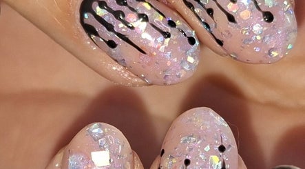 Sparkling nail art with black accents at Jade's Beaut's @No7, Woodville, England, GB.