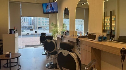 Chic interior of Black Oak Gents Salon in Dubai, Dubai, AE, featuring stylish barber chairs and modern decor.