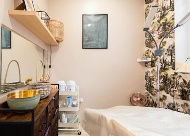 Cozy treatment room at Herbal Beauty Studio, London, England, GB with warm decor and relaxing ambiance.