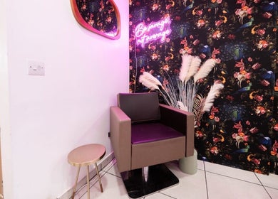 Stylish seating nook at Herbal Beauty Studio, featuring floral wallpaper in London, England, GB.