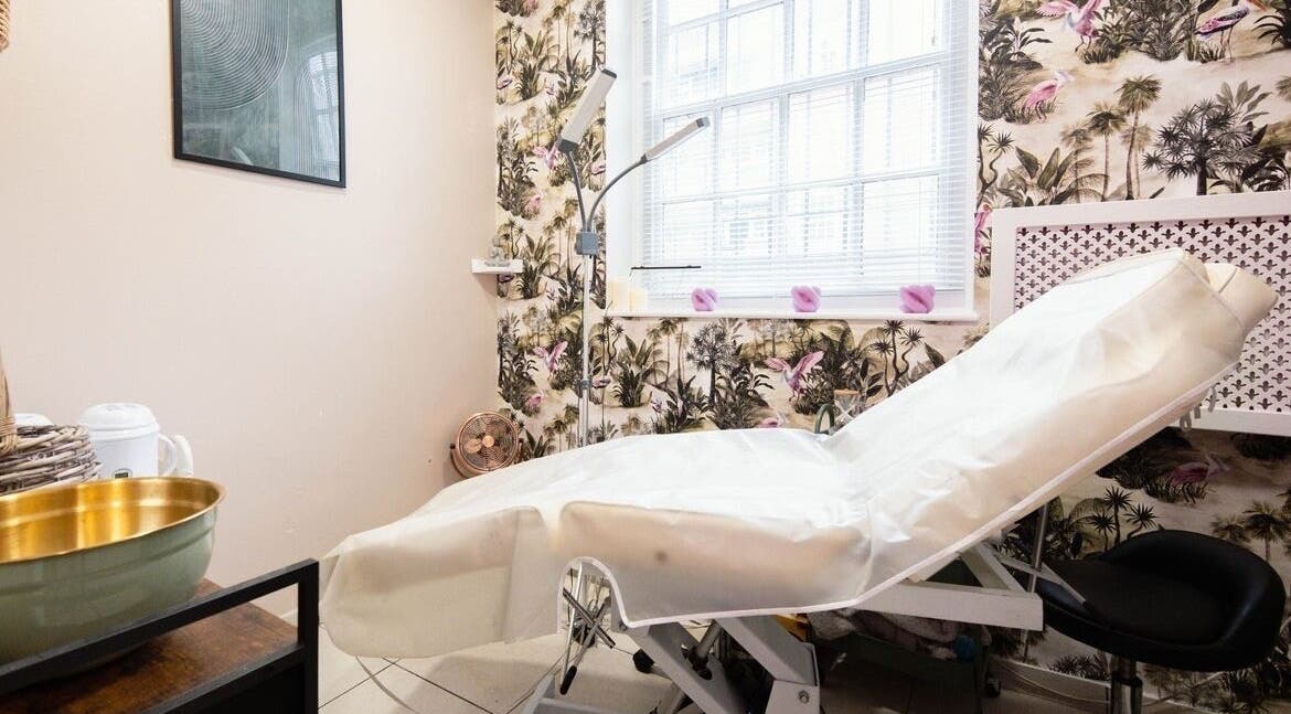Elegant spa interior at Herbal Beauty Studio, London, England, GB, showcasing a serene treatment bed.