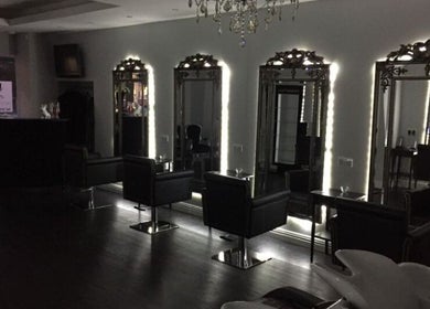 Chic salon interior with illuminated mirrors at Newcastle Hair Company, Newcastle upon Tyne, England, GB.