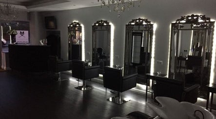 Chic salon interior with illuminated mirrors at Newcastle Hair Company, Newcastle upon Tyne, England, GB.