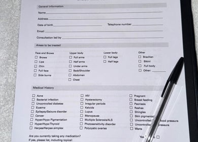 Client consultation form at Lumora Laser, Killingworth, England, GB, detailing treatment areas and medical history.
