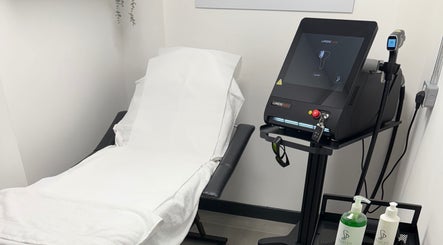 Laser machine and treatment bed at Lumora Laser, Killingworth, England, GB.