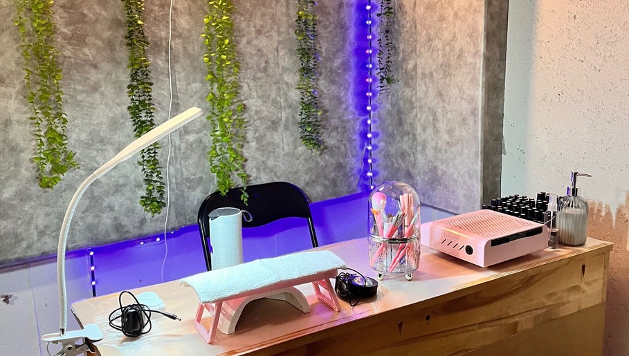 Chic nail station at LadamsNails, Ottawa, Ontario, CA, featuring tools, greenery, and soft lighting.