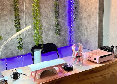 Chic nail station at LadamsNails, Ottawa, Ontario, CA, featuring tools, greenery, and soft lighting.