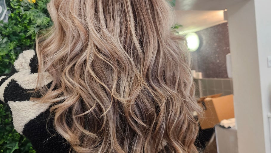 Glossy curls styled at Hair By Suzannee, Heswall, England, GB. Showcasing salon's expert hairstyling.