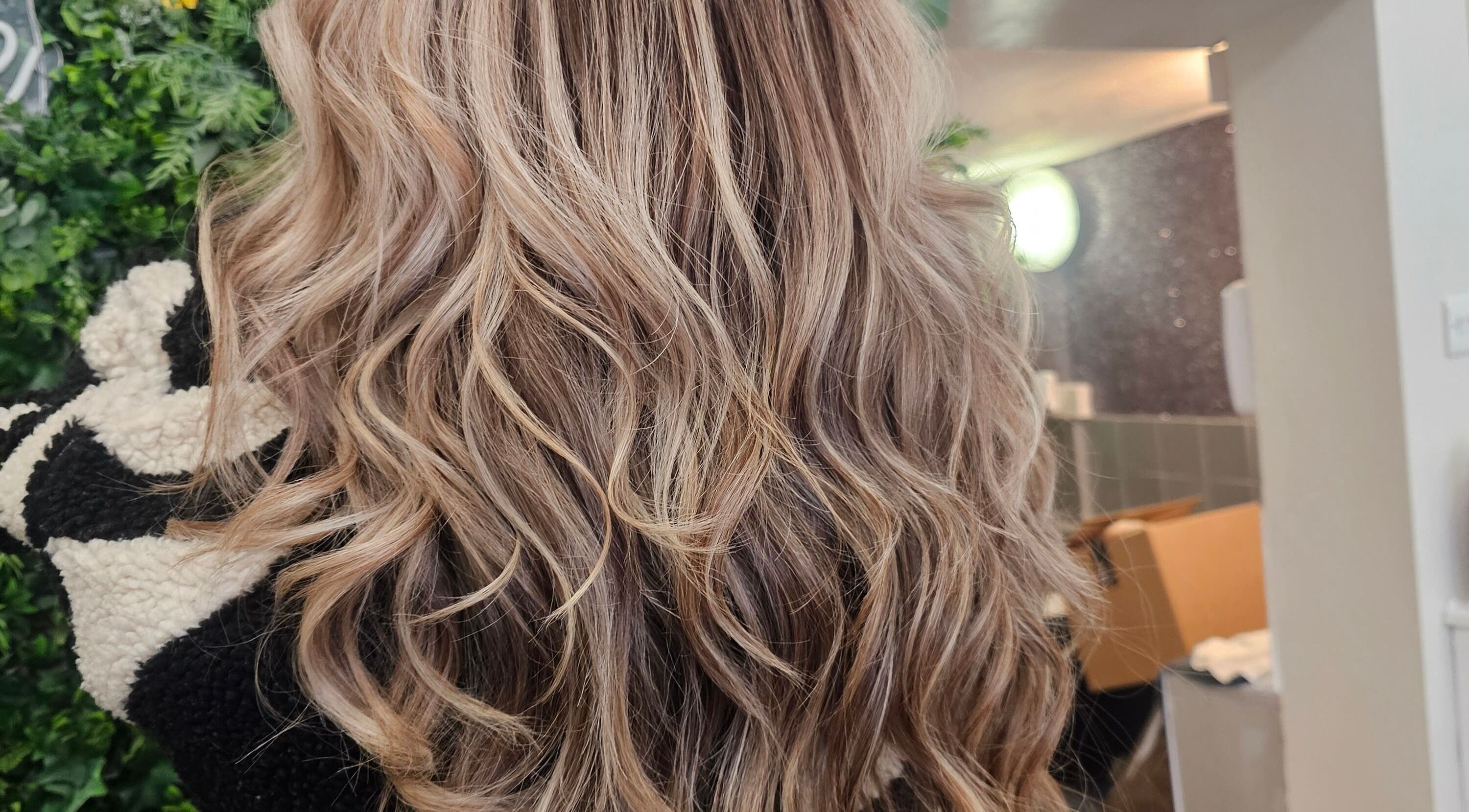 Glossy curls styled at Hair By Suzannee, Heswall, England, GB. Showcasing salon's expert hairstyling.