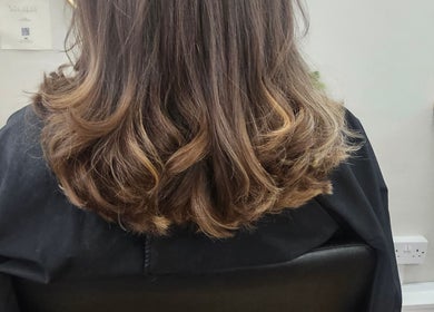 Beautiful curled hairstyle at Hair By Suzannee, Heswall, England, GB. Elegant and stylish hair treatment.