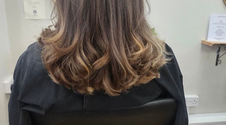 Beautiful curled hairstyle at Hair By Suzannee, Heswall, England, GB. Elegant and stylish hair treatment.