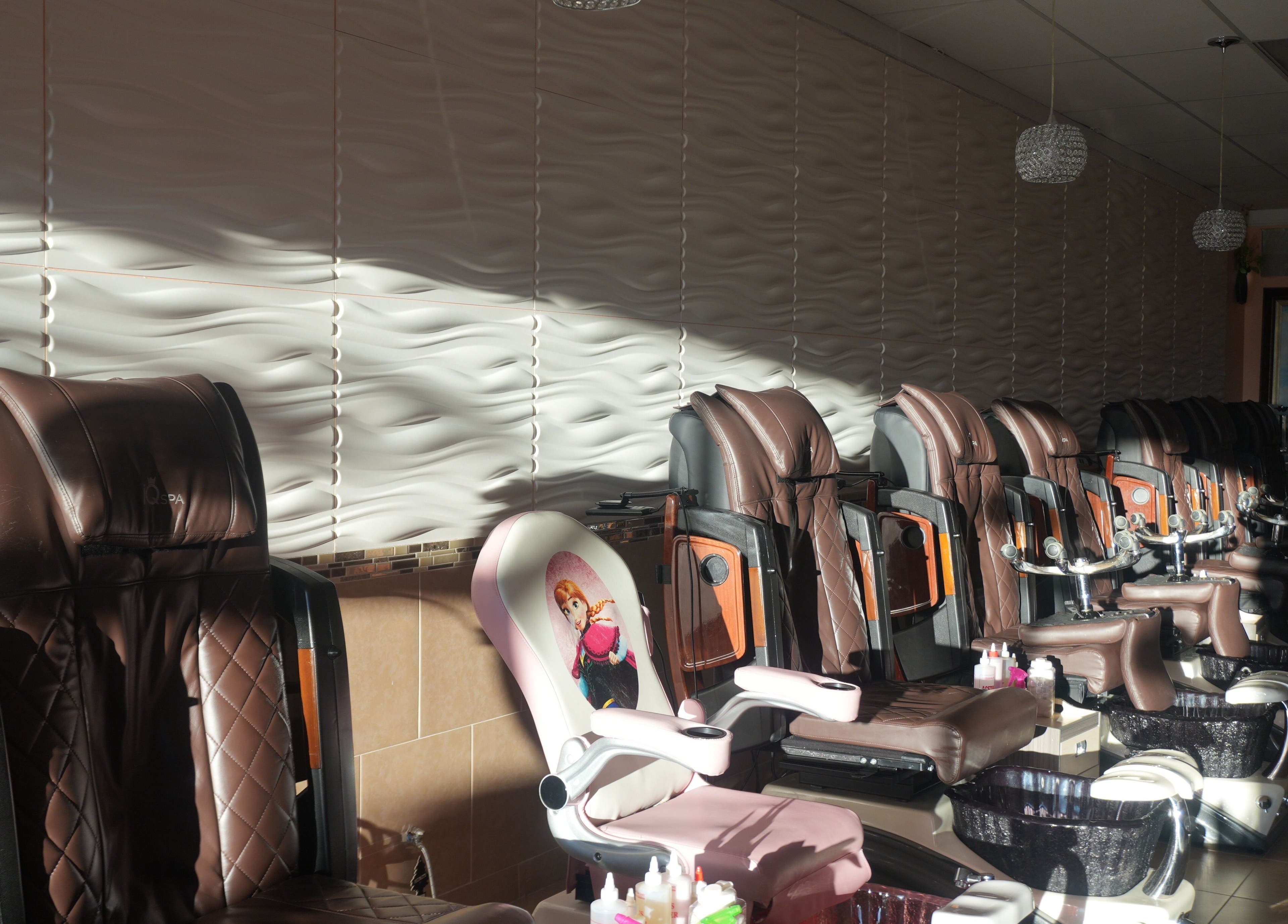 Comfortable spa chairs at Awesome Nails in Lexington, Kentucky, US ready for pampering sessions.