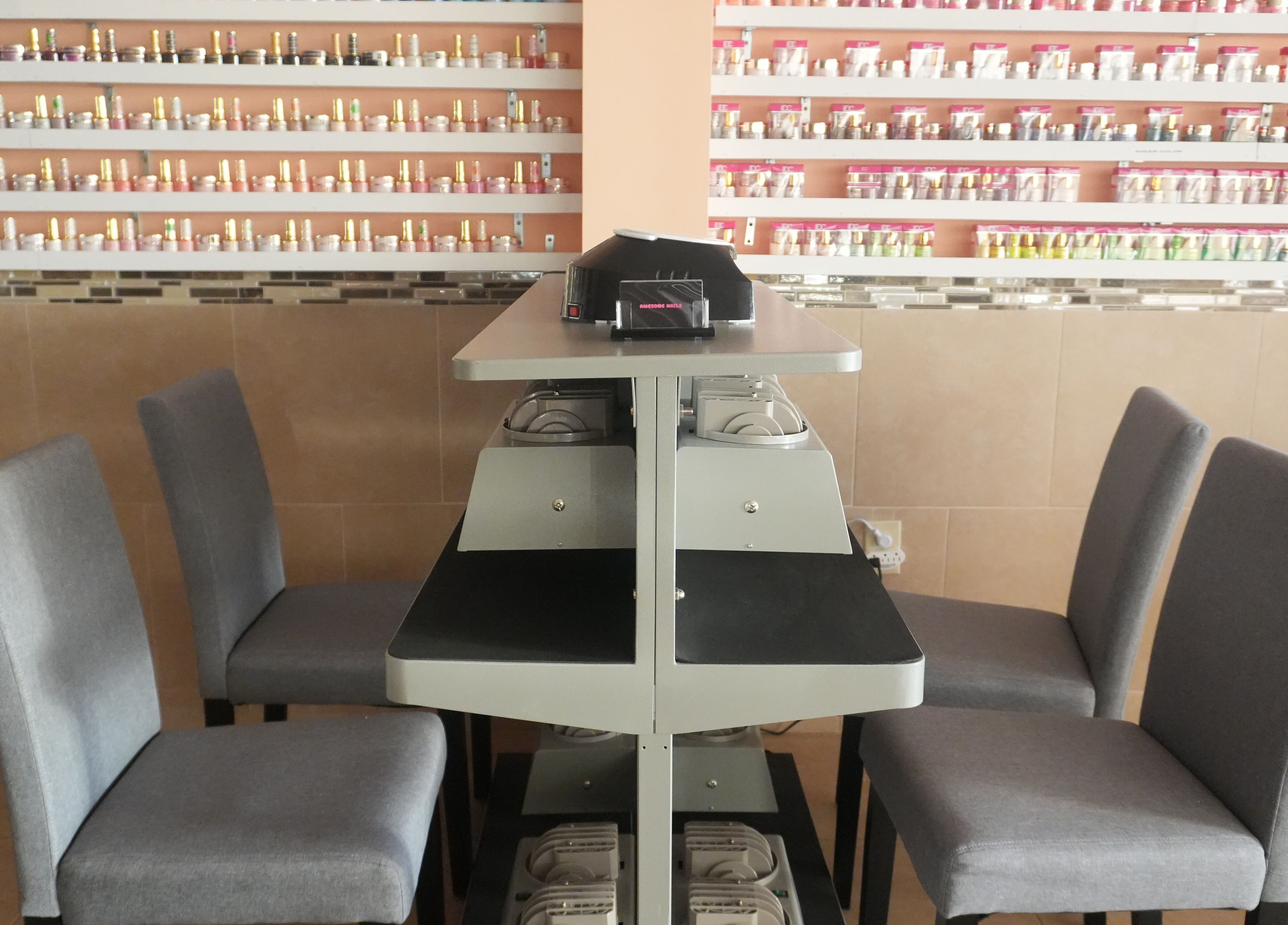 Nail polish display at Awesome Nails, Lexington, Kentucky, US, showcasing a variety of colors.