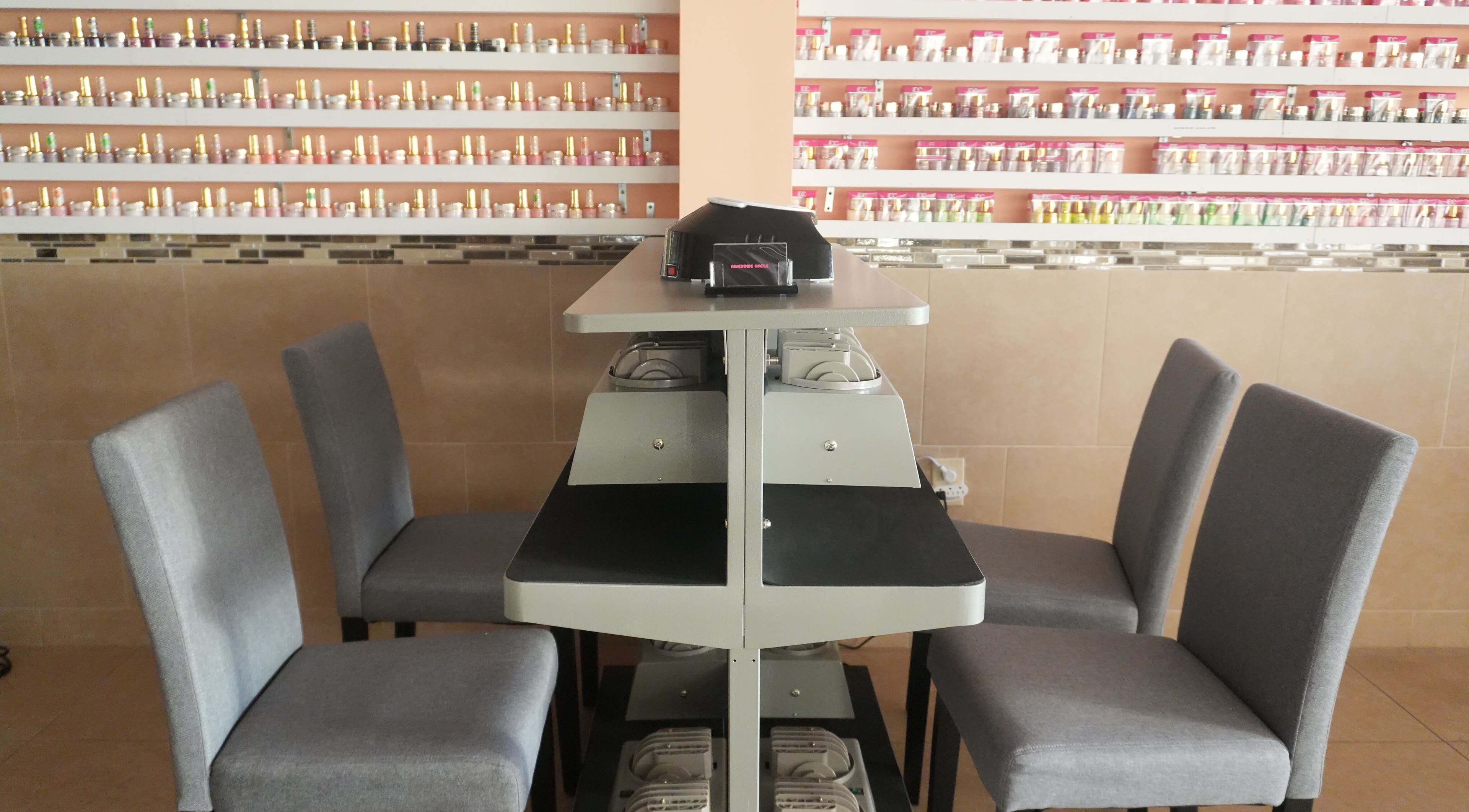 Nail polish display at Awesome Nails, Lexington, Kentucky, US, showcasing a variety of colors.