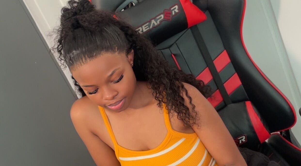 Woman seated, styled hair at SlayedbyNikita, Cape Town, Western Cape, ZA.