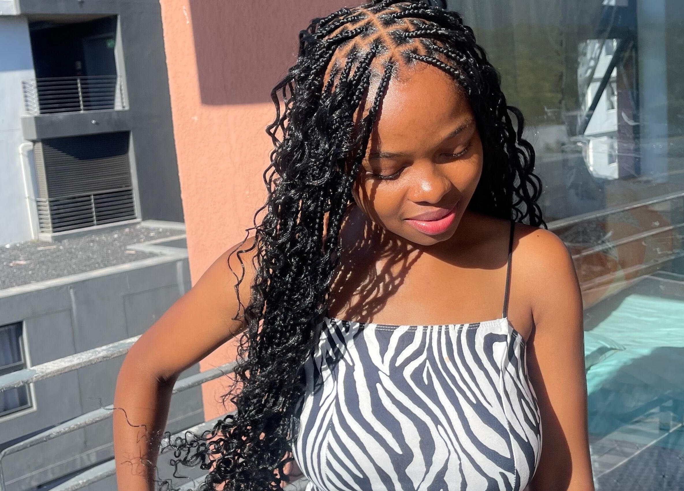 Stylish braided hairstyle at SlayedbyNikita, Cape Town, Western Cape, ZA, adding radiant beauty.