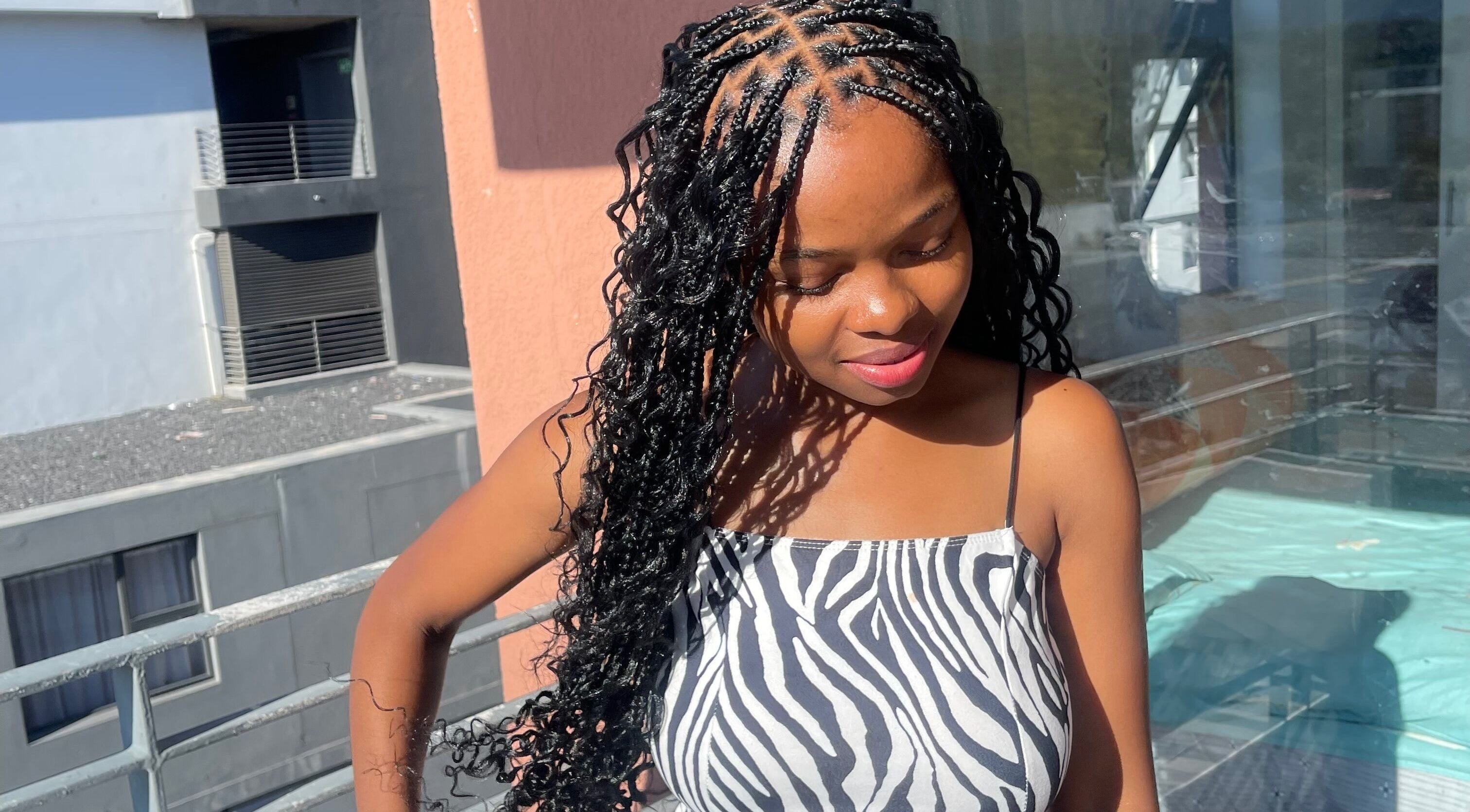 Stylish braided hairstyle at SlayedbyNikita, Cape Town, Western Cape, ZA, adding radiant beauty.