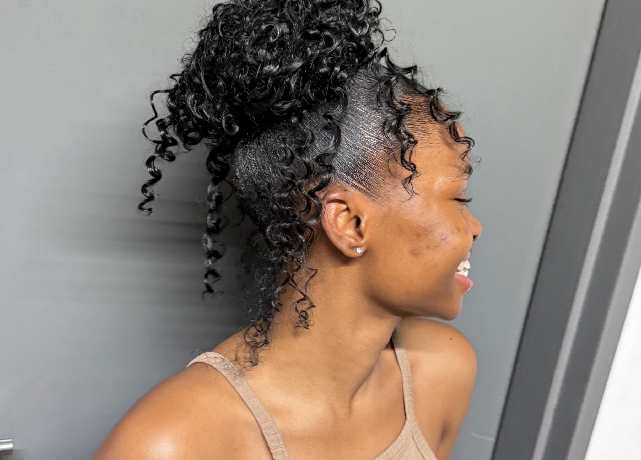 Client with curly updo at SlayedbyNikita, Cape Town, Western Cape, ZA. Perfect hairstyle for a chic look.