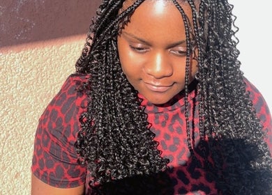 Woman with stunning braids at SlayedbyNikita, Cape Town, Western Cape, ZA, showcasing intricate hairstyle.