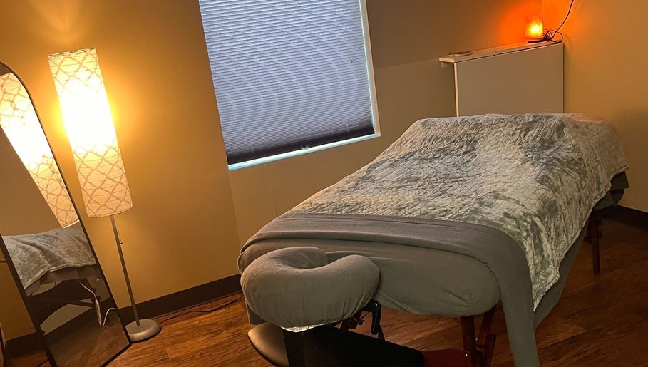 Peaceful massage room at Prairie Place RMT, Vermilion, Alberta, CA, with warm lighting and a cozy massage table.