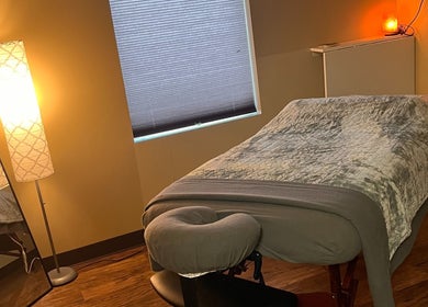 Peaceful massage room at Prairie Place RMT, Vermilion, Alberta, CA, with warm lighting and a cozy massage table.