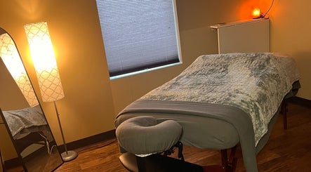 Peaceful massage room at Prairie Place RMT, Vermilion, Alberta, CA, with warm lighting and a cozy massage table.