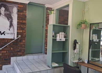Elegant salon interior at Flow By Ane, Pretoria, Gauteng, ZA, featuring beauty products and styling stations.