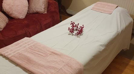 Massage bed with soft pink towels at Oriental Full Body Massage Norwich, Norwich, England, GB.