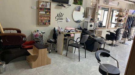 Interior of The Point Haircut & Spa, Accra, showing nail and hair stations.
