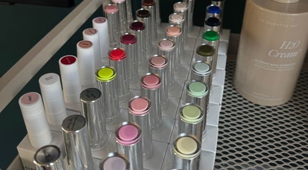 Colorful nail polish selection at Mani By Lucie, Bromley, England, GB, showcasing vibrant beauty products.